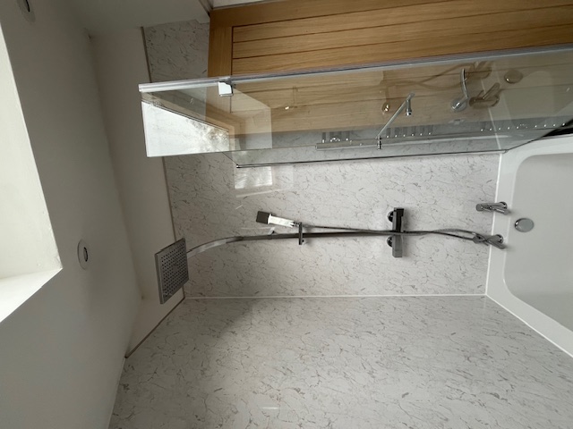 Bathroom after refurb - rain shower, marble panels