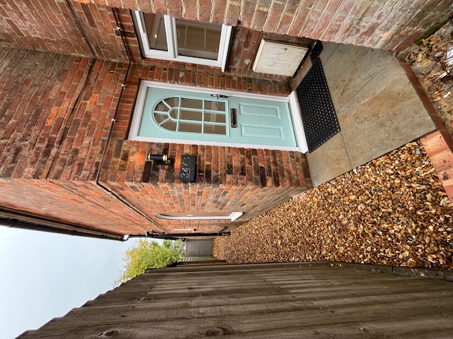 Exterior after refurb - blue door, clean finish