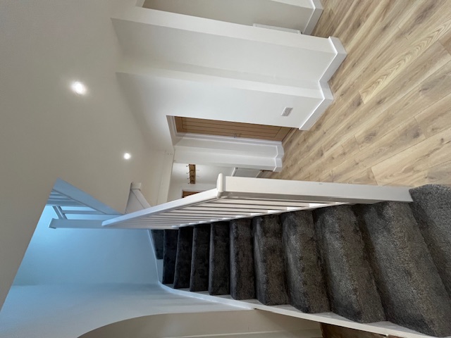 Hallway after refurb - curved staircase, finished hallway