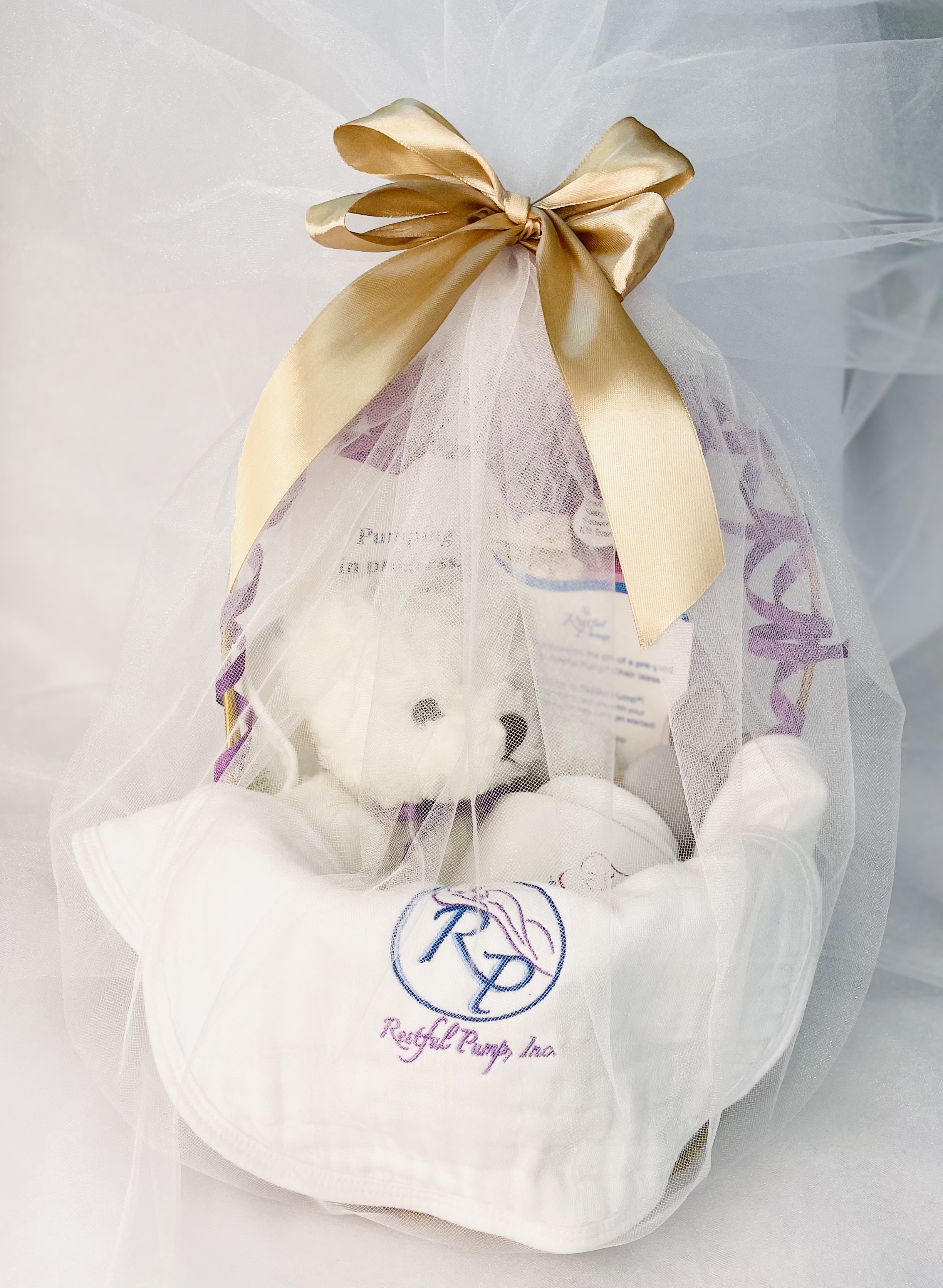 Restful Pump Chair Gift Basket — white tulle, gold ribbon, embroidered burp cloth, white teddy bear
