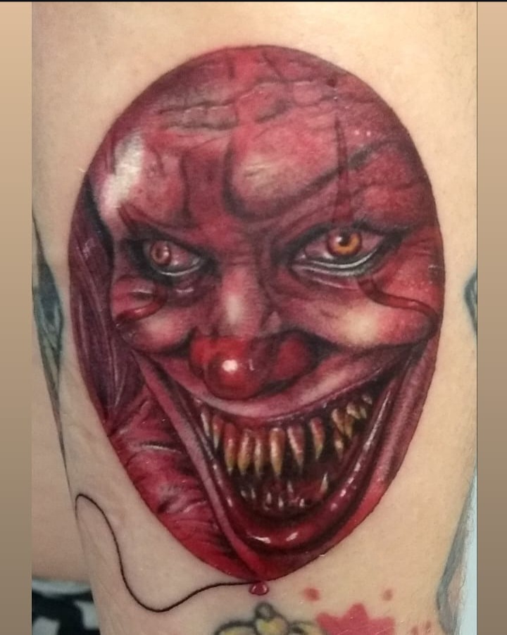 Horror clown Pennywise balloon colour realism tattoo by Tori Talio
