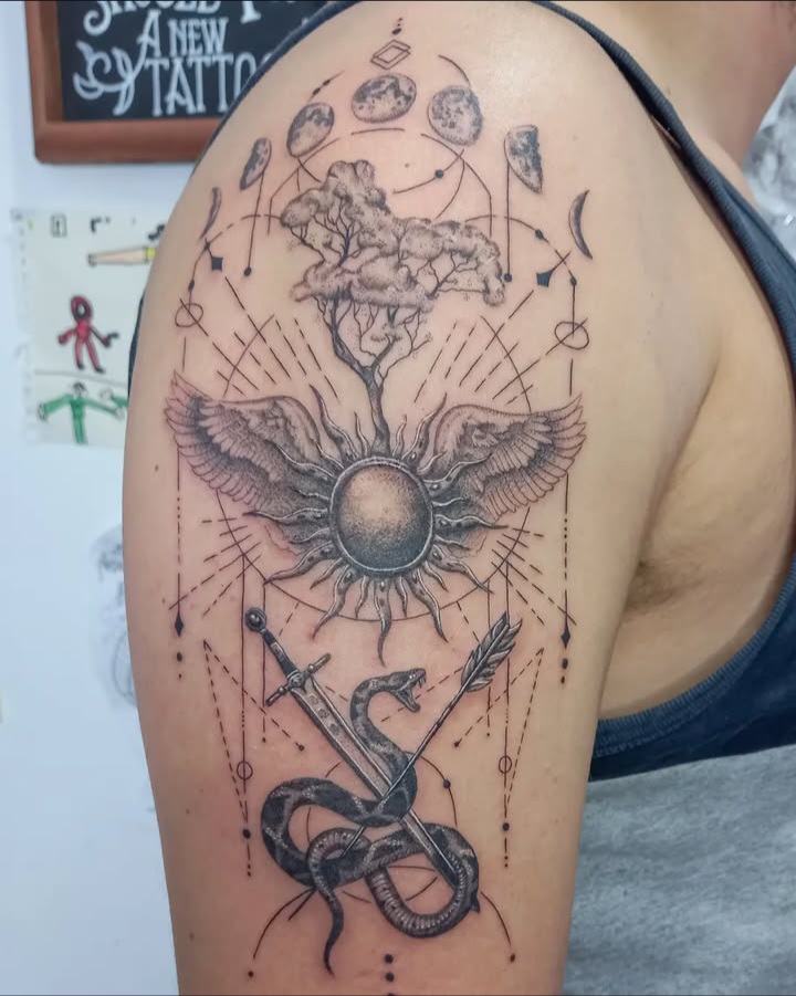 Celestial tree of life moon phases snake sword upper arm tattoo by Tori Talio