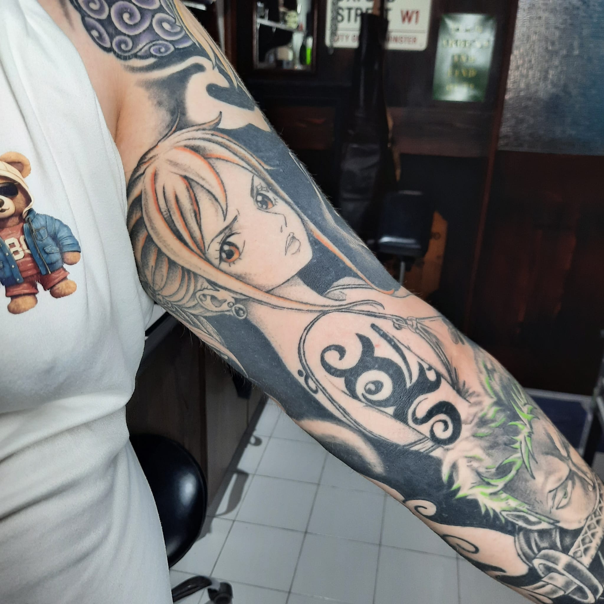 One Piece Nami sleeve tattoo by Luca Falzon