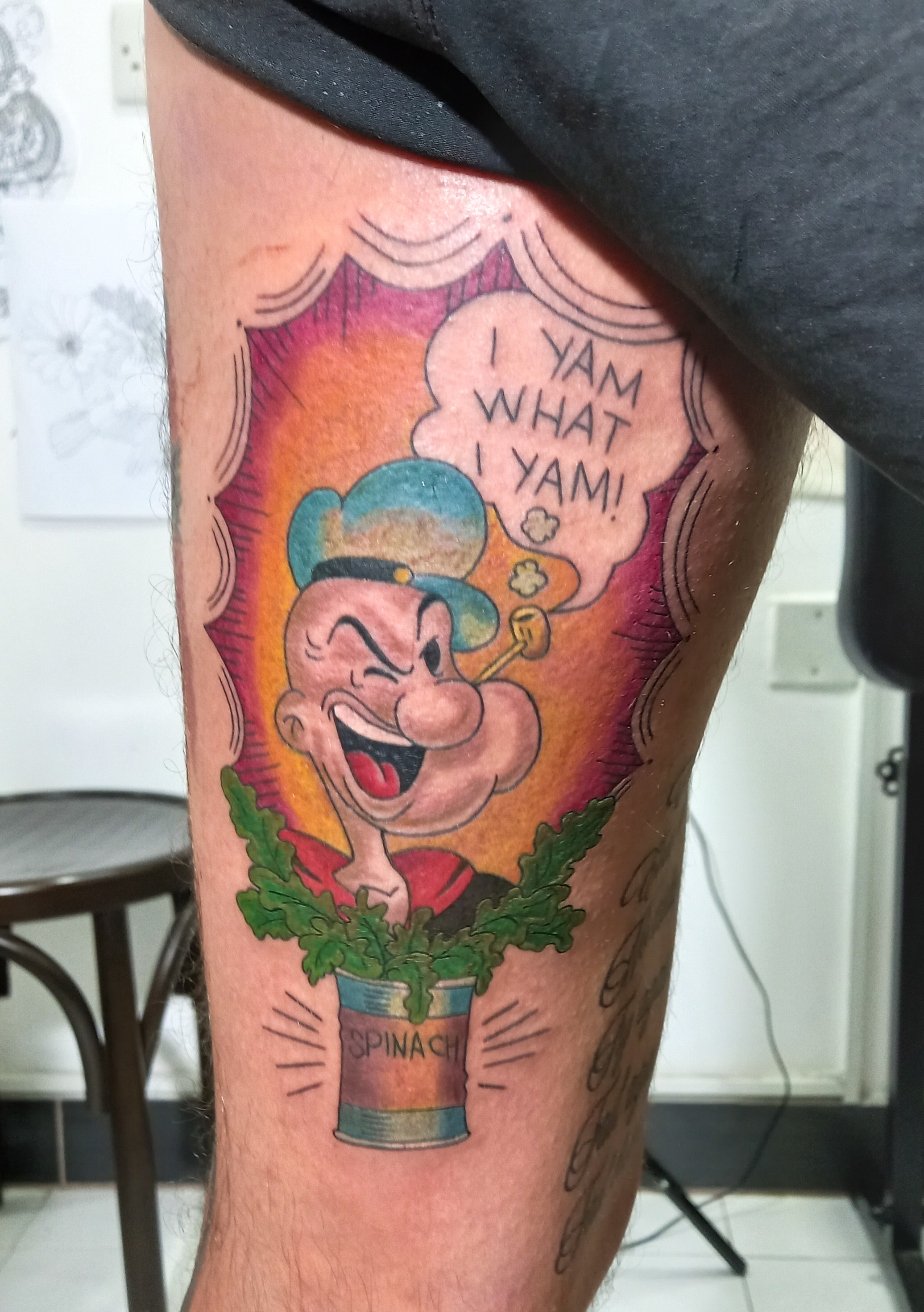Popeye I Yam What I Yam colour thigh tattoo by Tori Talio