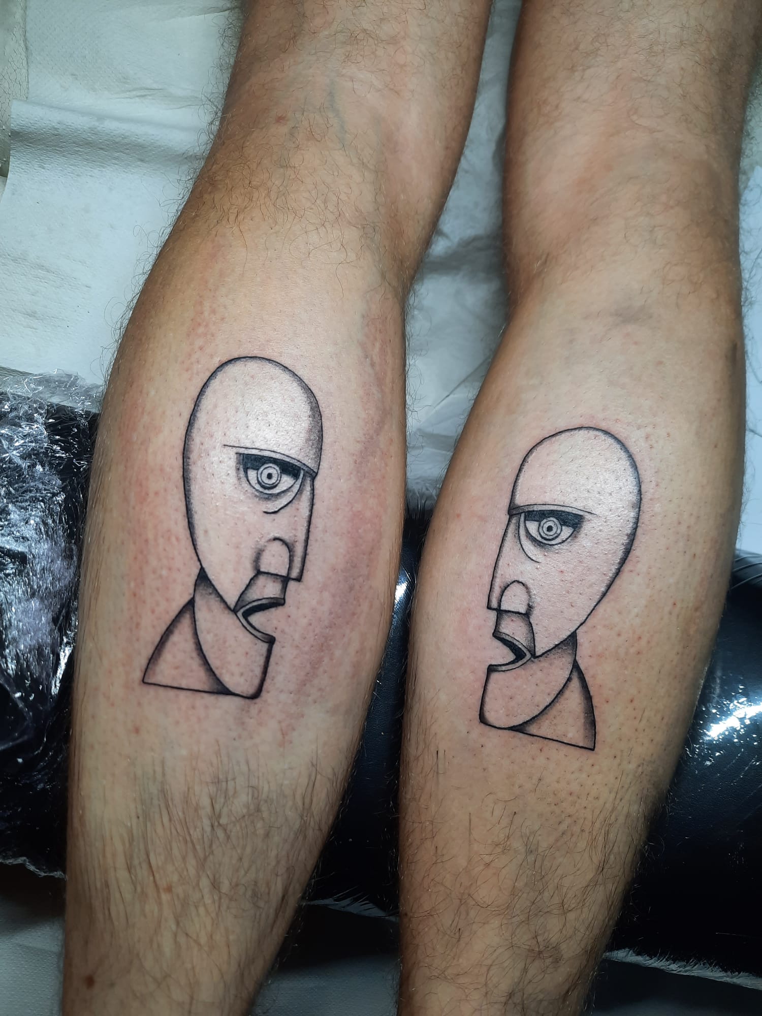 Pink Floyd Division Bell matching tattoos by Luca Falzon