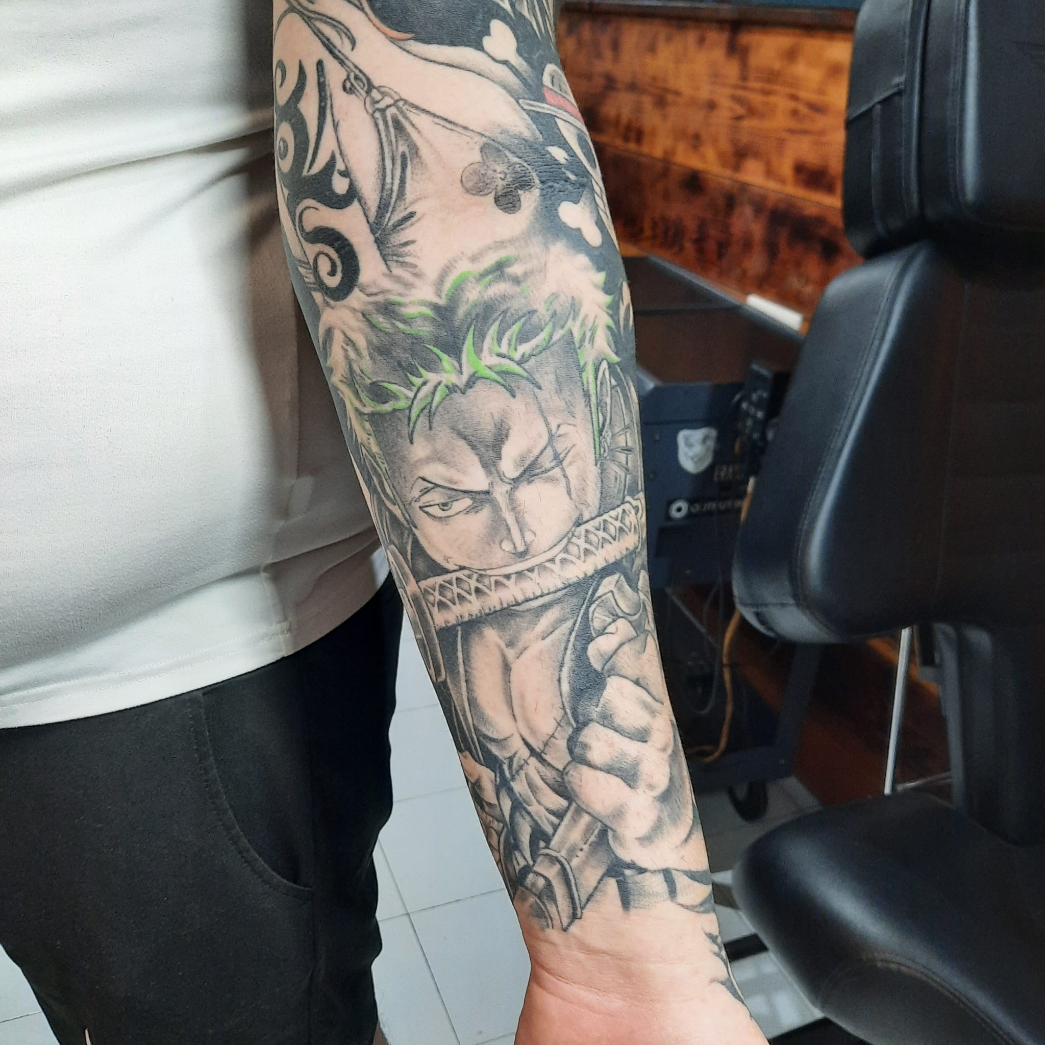 One Piece Zoro sleeve tattoo by Luca Falzon