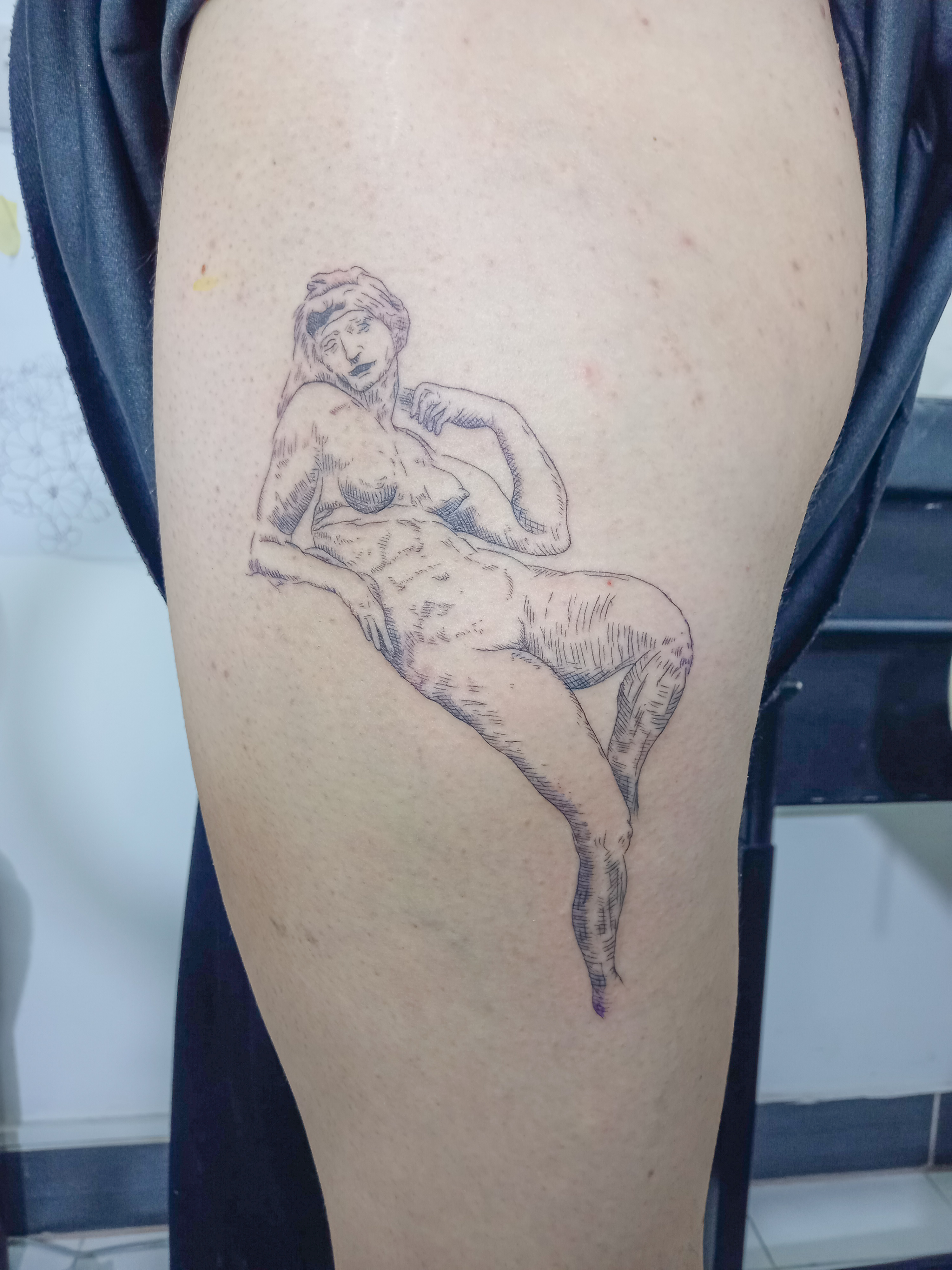 Classical reclining figure sketch style thigh tattoo by Tori Talio