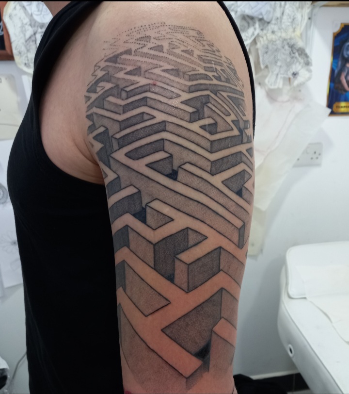 3D maze labyrinth half sleeve upper arm tattoo by Tori Talio
