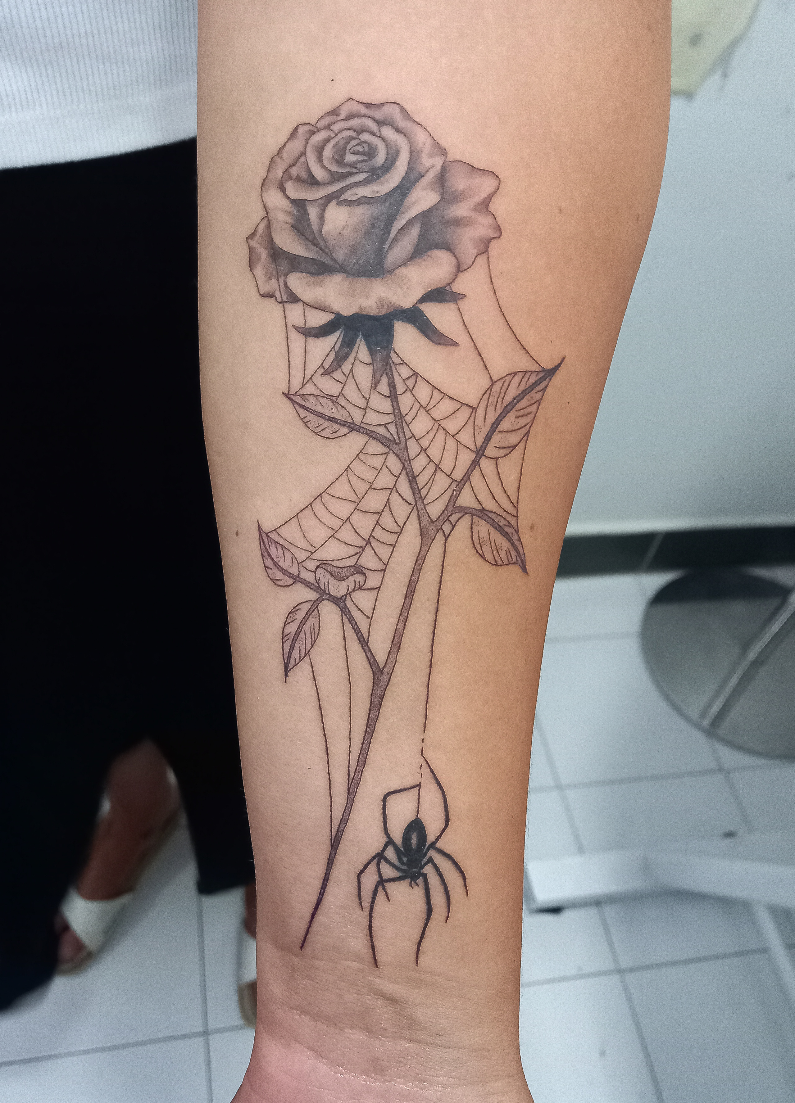 Rose with spider web and spider forearm tattoo by Tori Talio