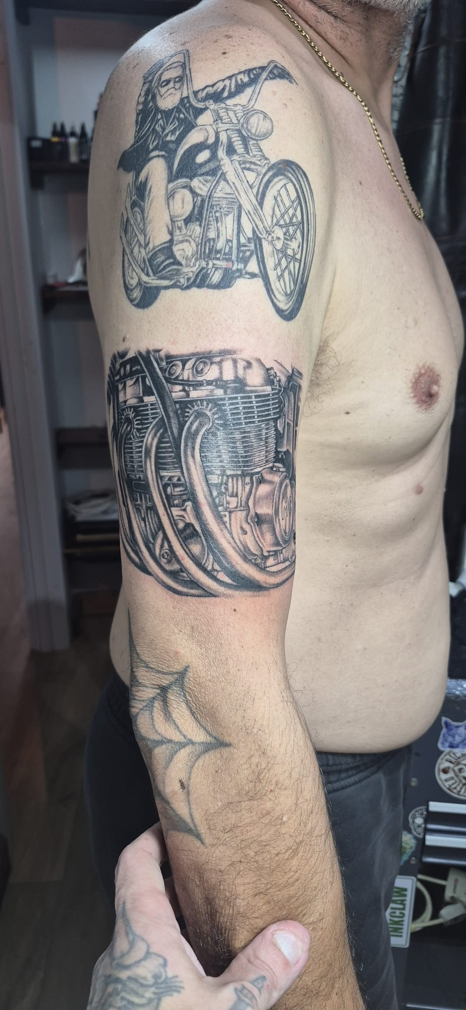 Biker and motorcycle engine upper arm tattoo by Luca Falzon