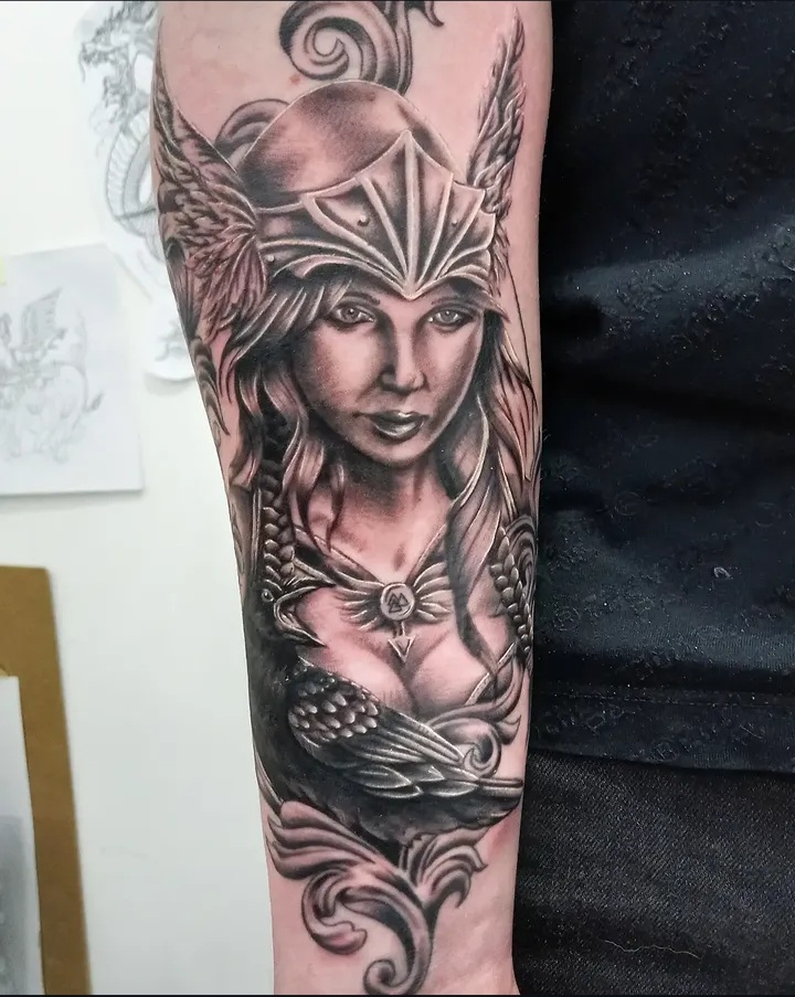 Valkyrie warrior woman with raven forearm tattoo by Tori Talio