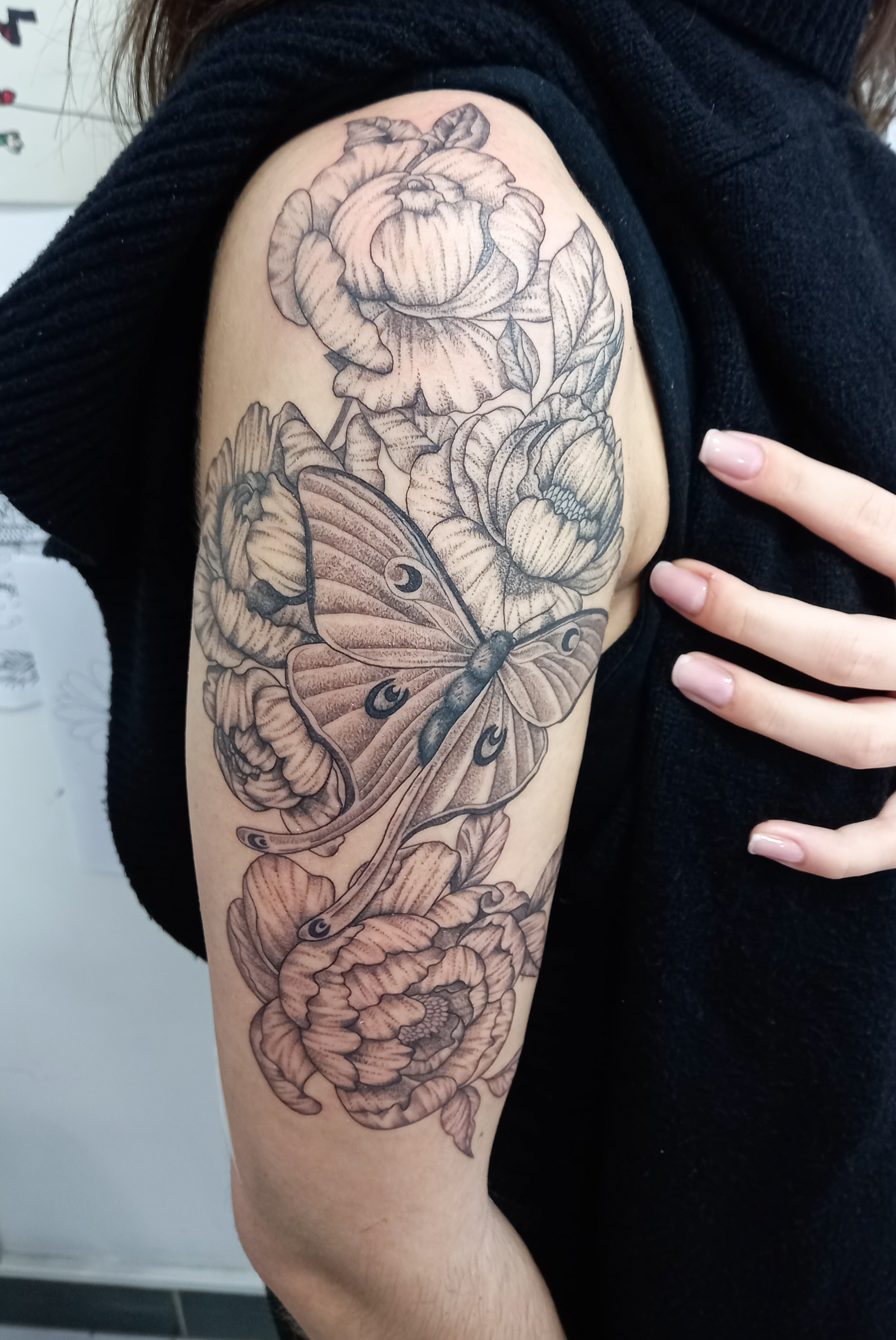 Peonies with luna moth half sleeve upper arm tattoo by Tori Talio