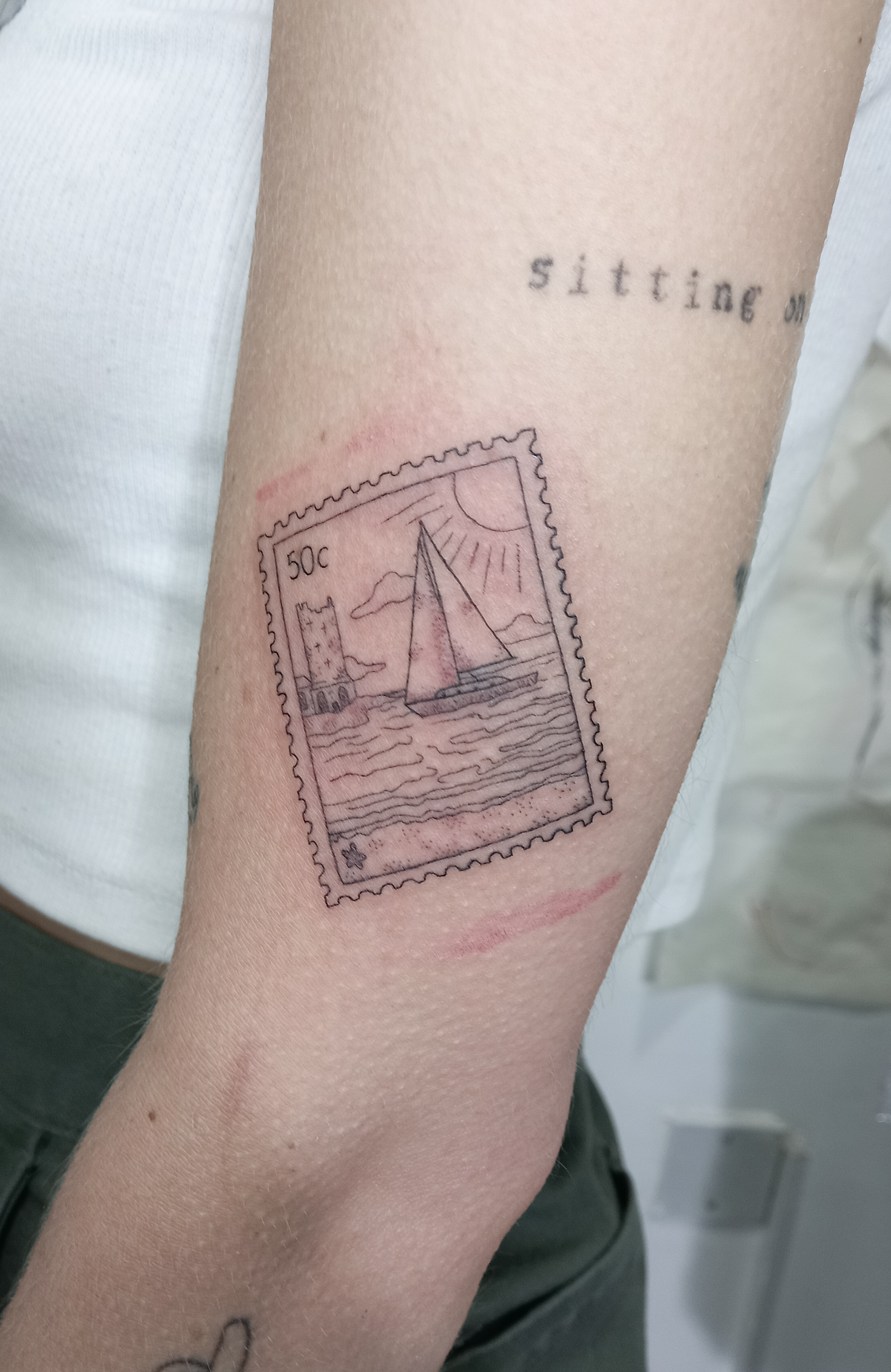 Malta postage stamp sailboat fine line inner arm tattoo by Tori Talio