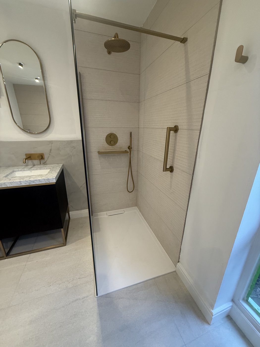 Walk-in shower, brushed gold fixtures