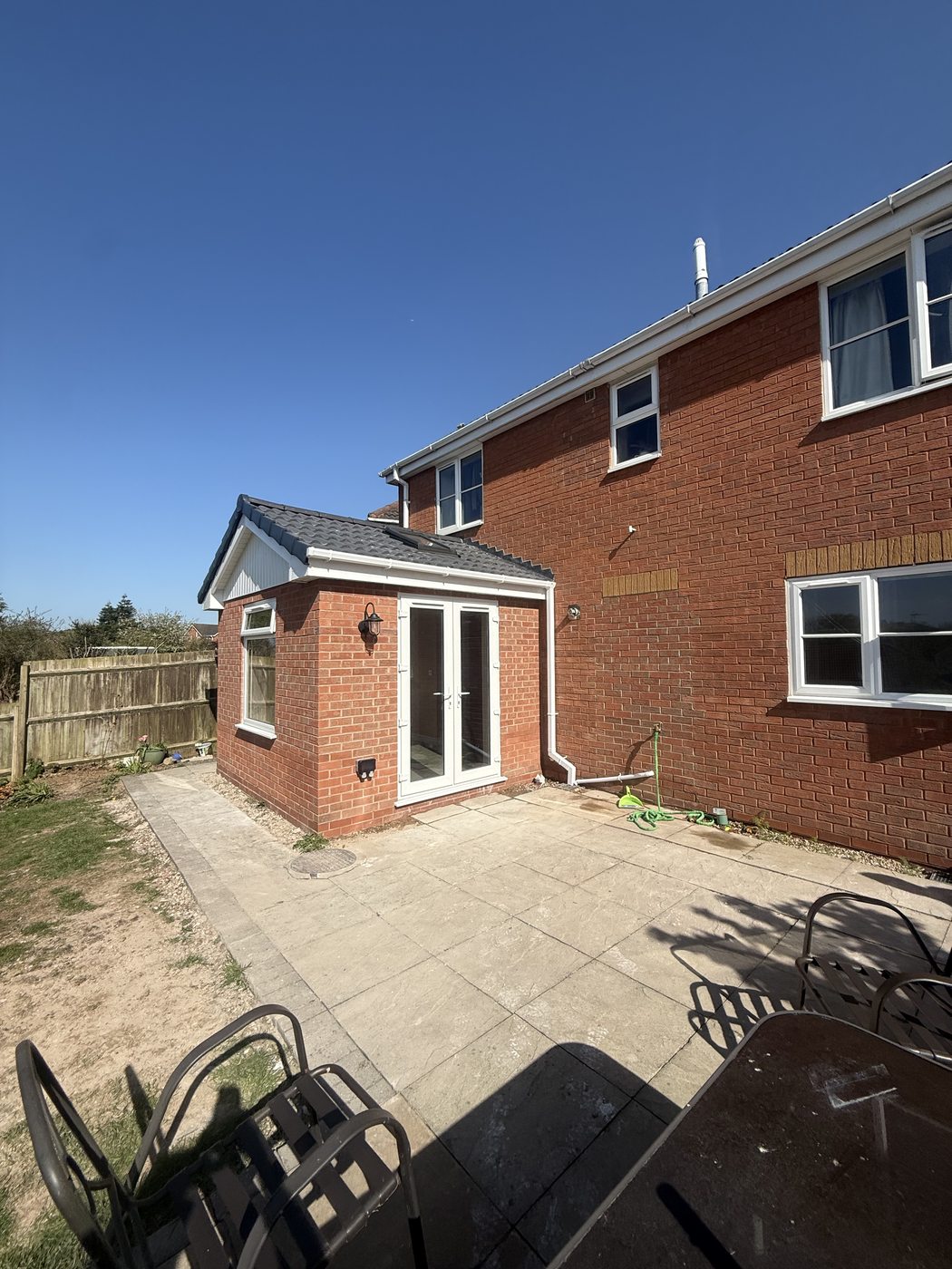 Completed extension โ French doors and tiled roof