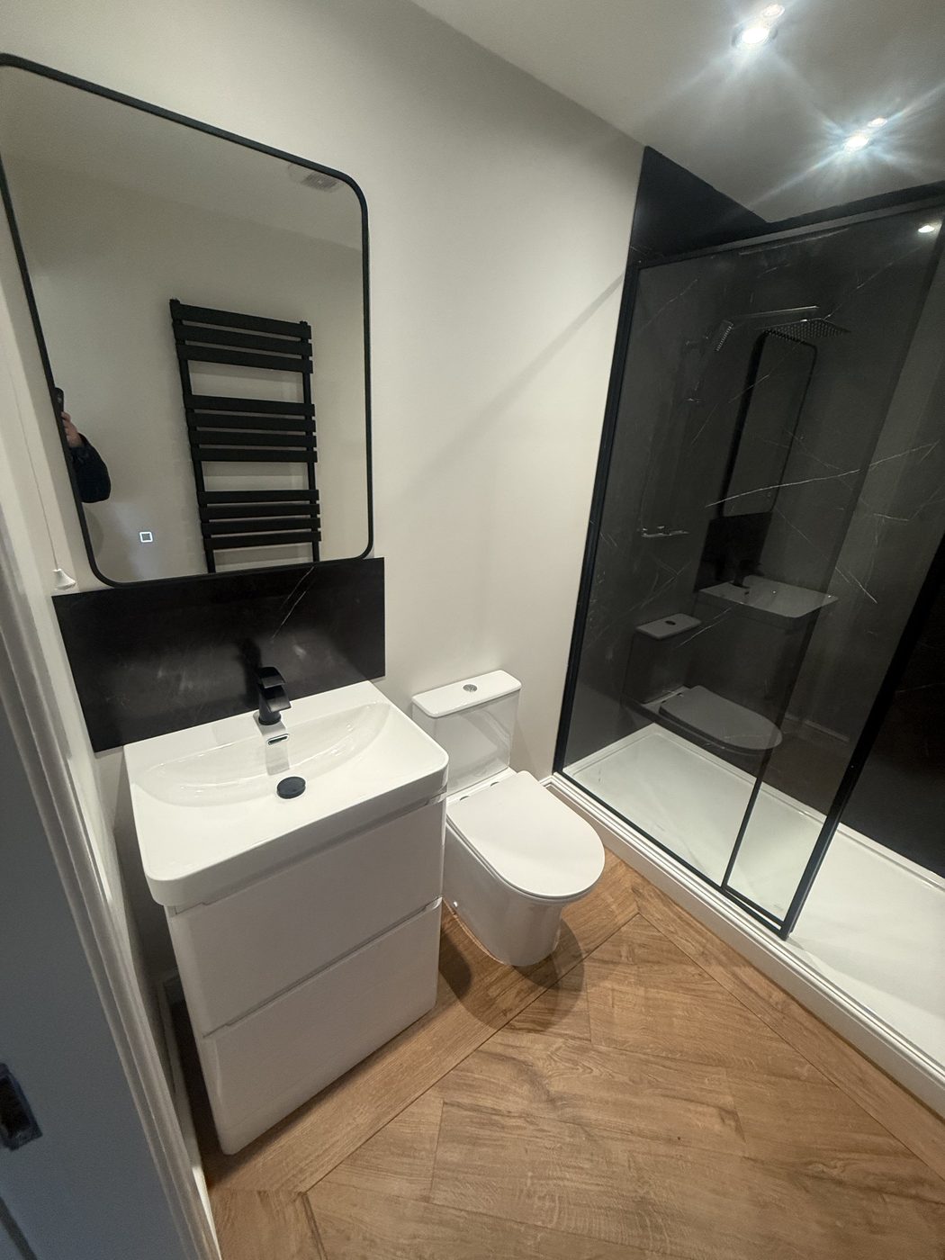 Completed — floating vanity, black fixtures