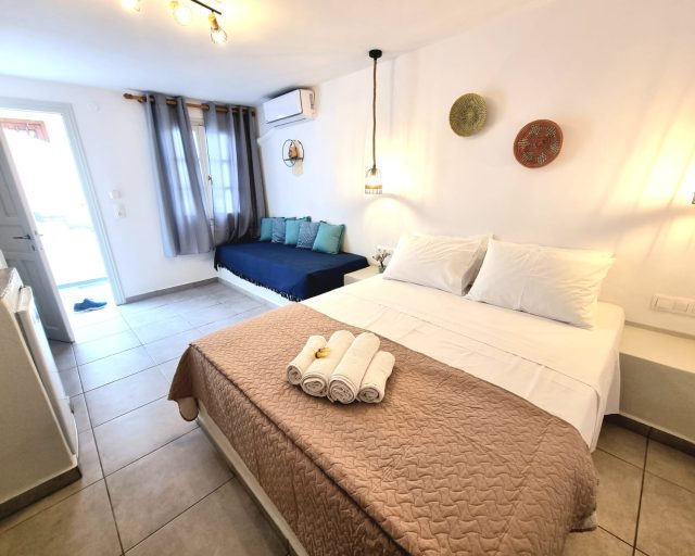 Spacious bedroom with sofa area