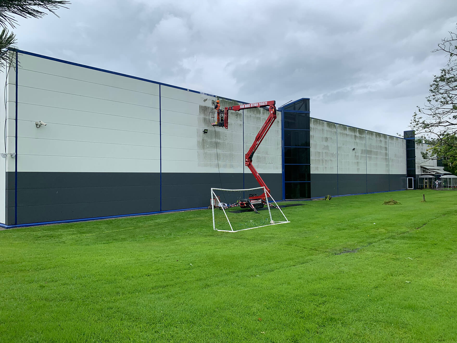 Commercial building cladding clean in progress — Clean Sweep Group South Wales