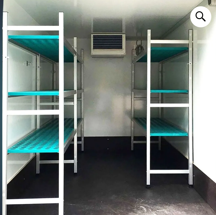 Inside the fridge trailer showing shelving