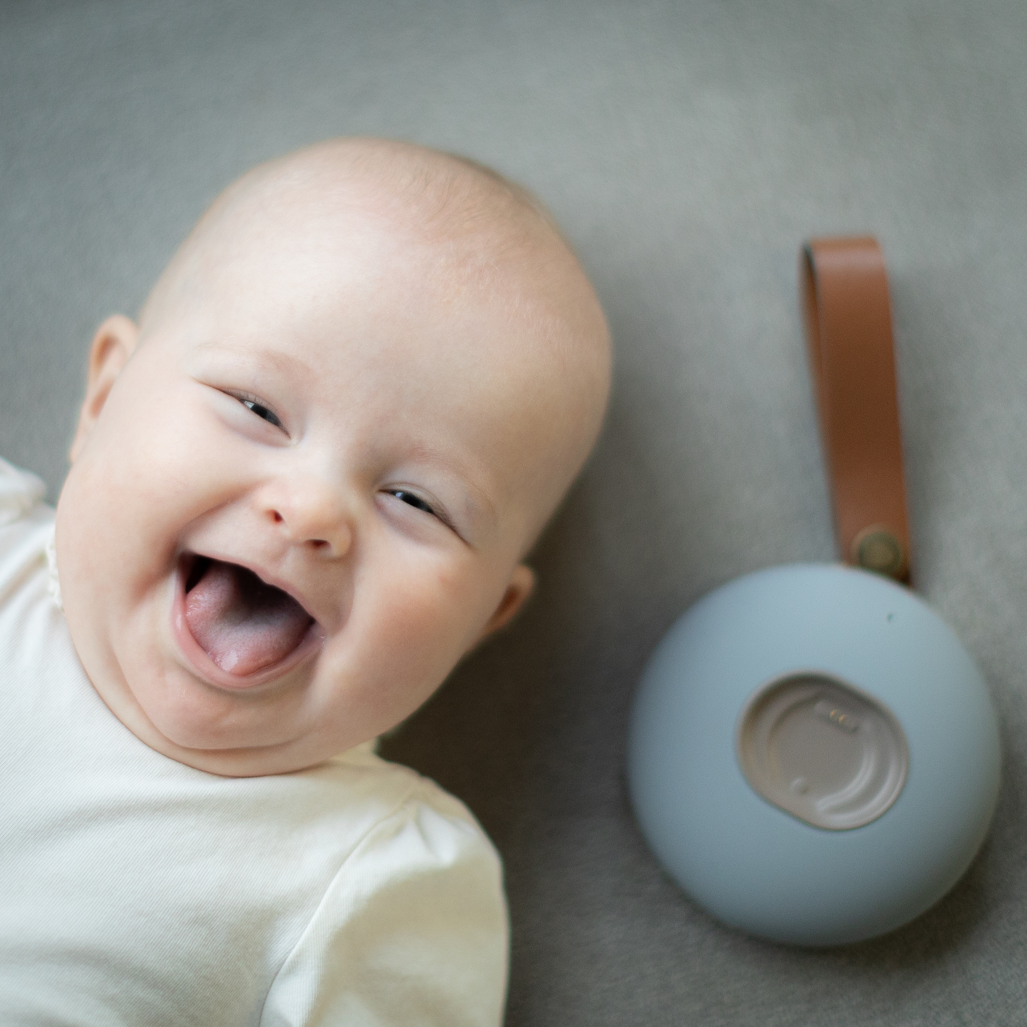 Happy baby with BabySensor base station