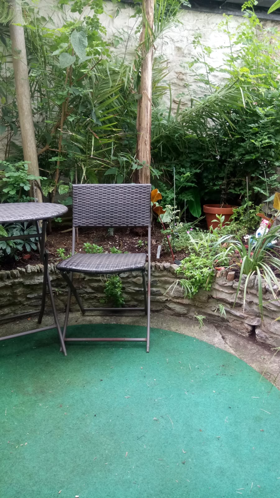 Private courtyard garden with seating area