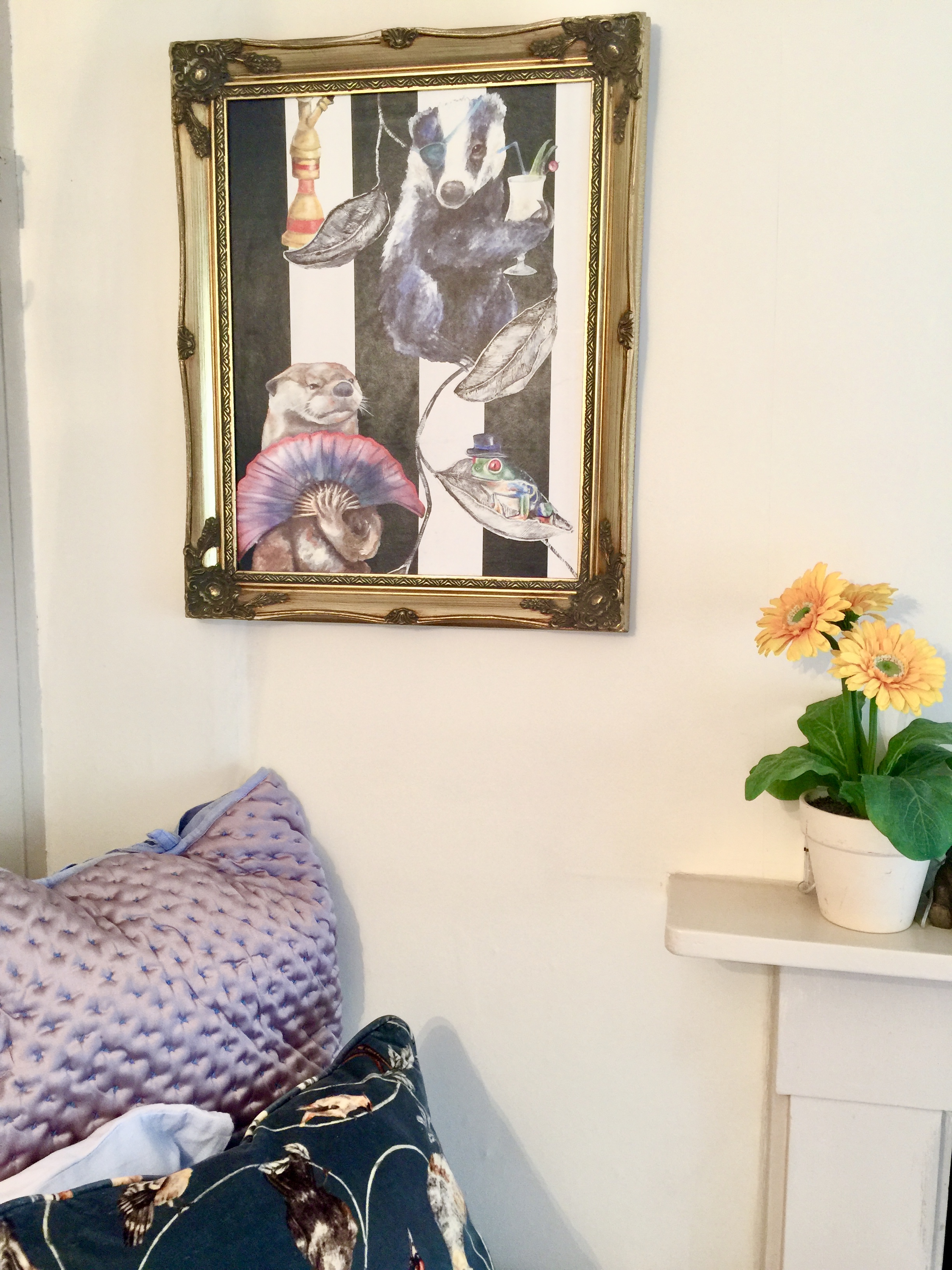 Quirky artwork and cosy bedroom details