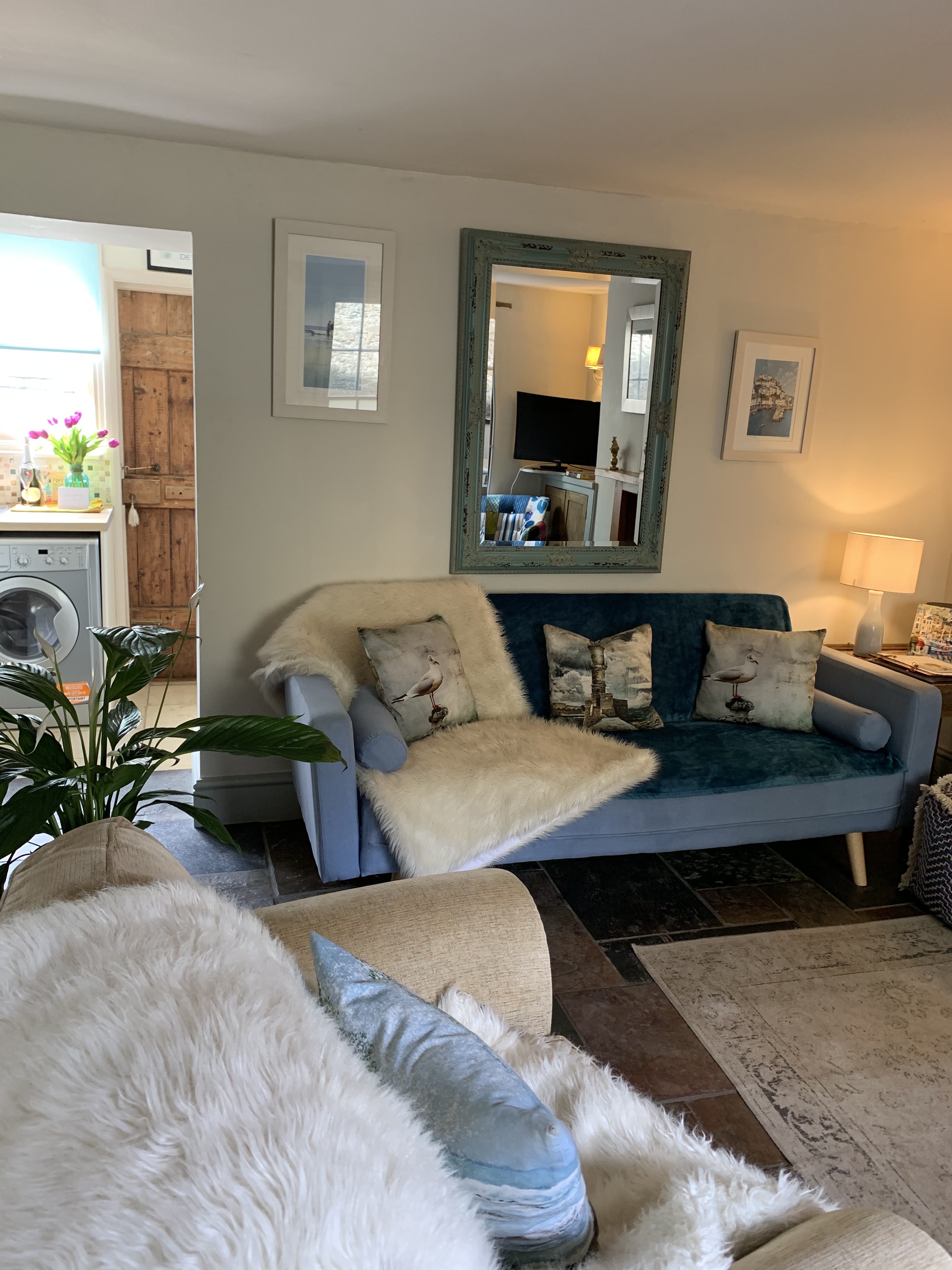 Cosy living room with sofa and coastal decor