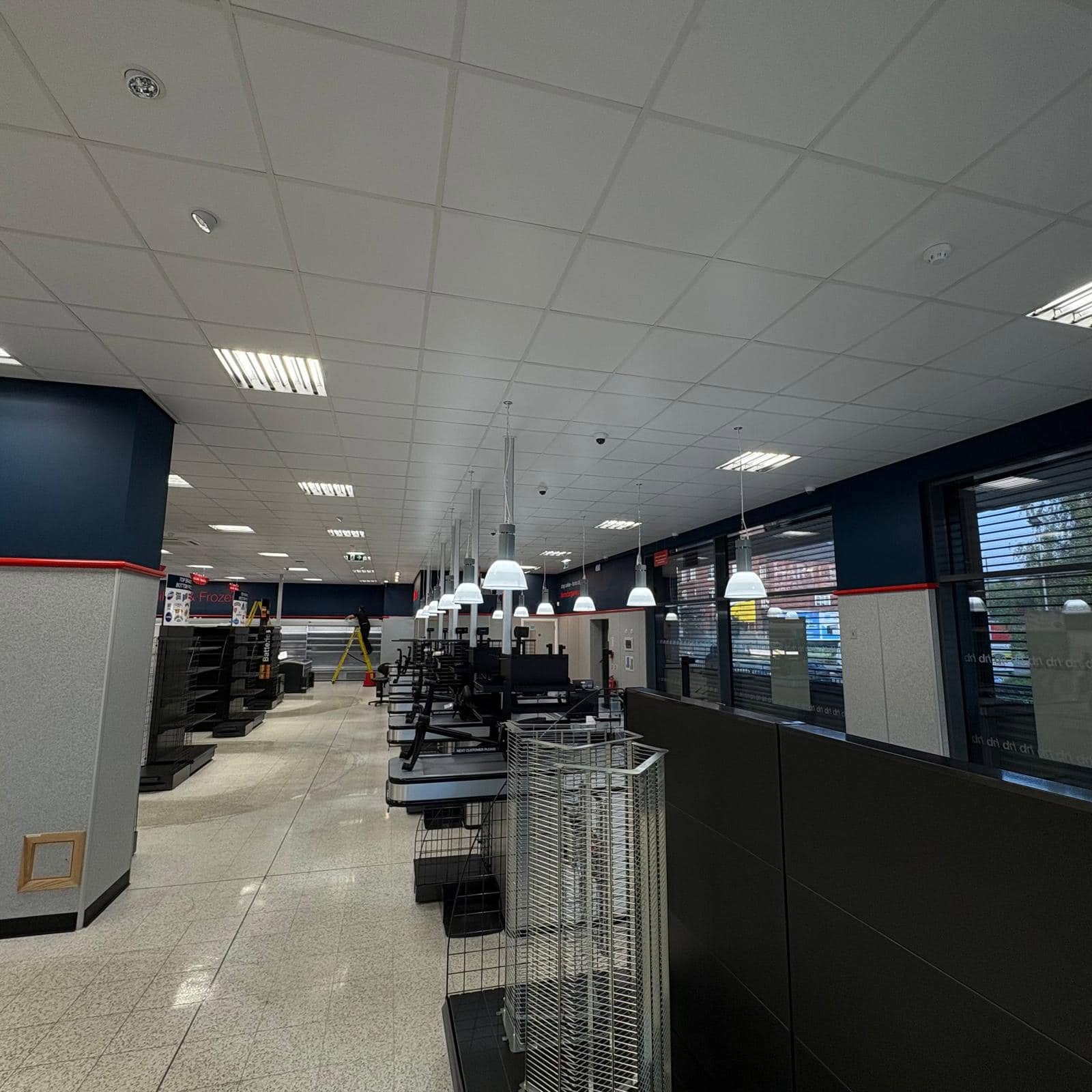 Commercial shopfitting electrical installation with pendant lighting