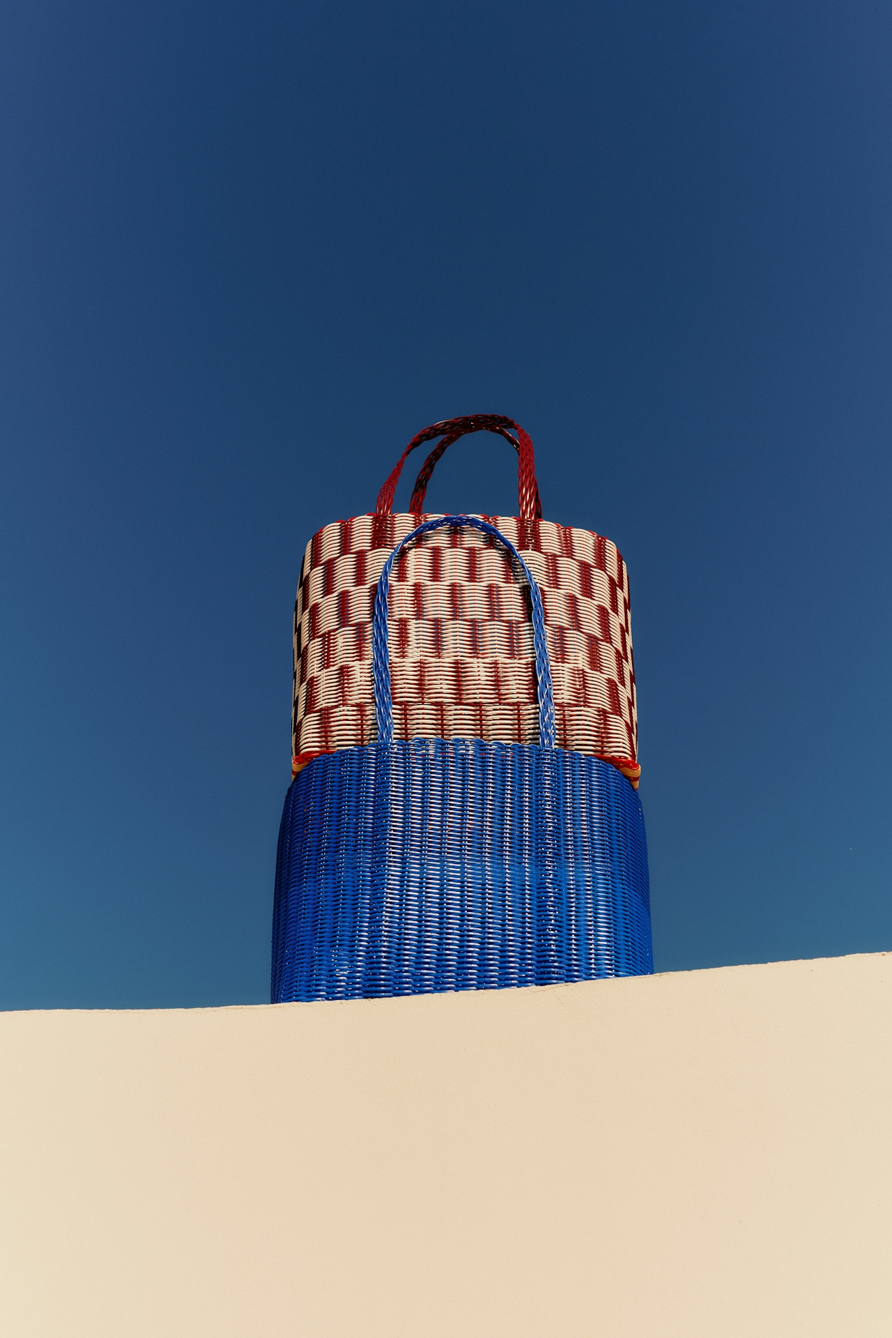 Woven basket against deep blue sky