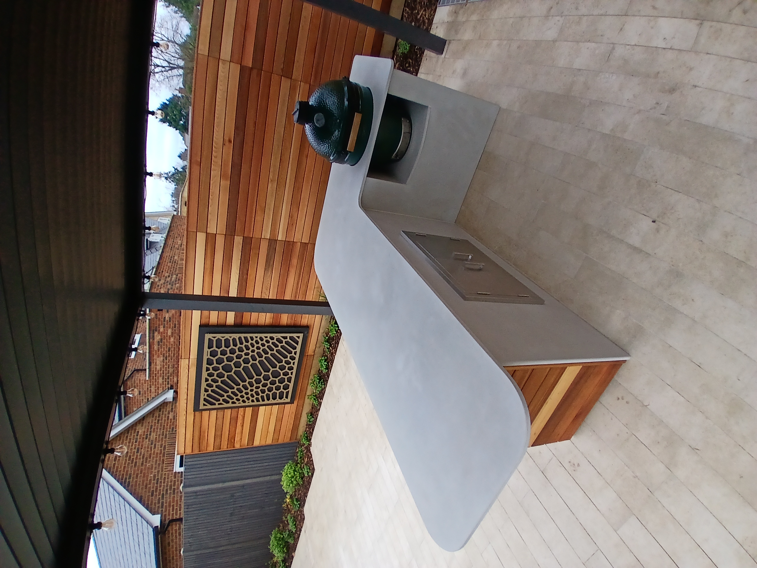 VERTEO polished concrete outdoor kitchen counter with Big Green Egg ceramic smoker