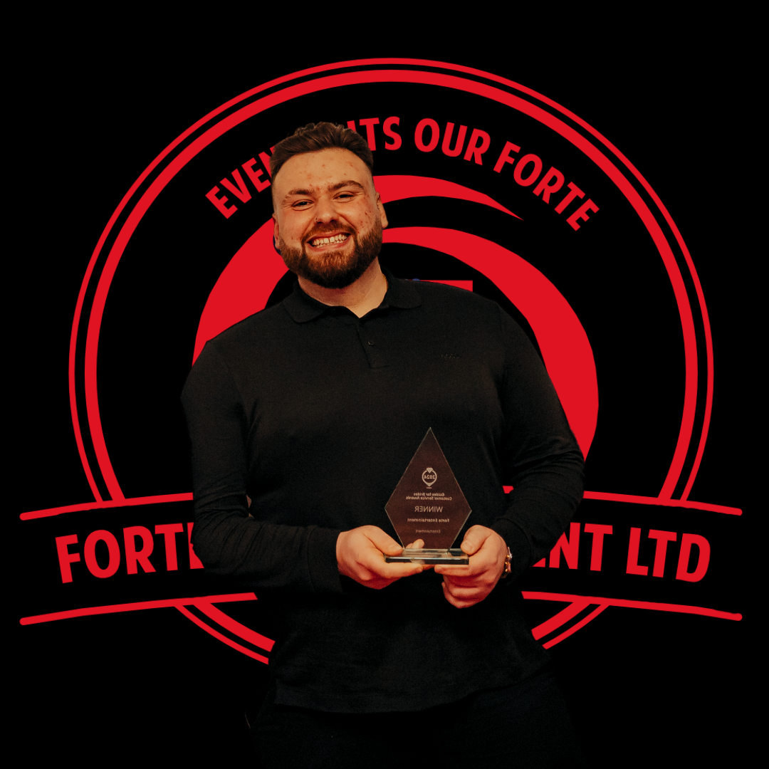 Oscar Forte - Founder & CEO of Forte Entertainment, holding Customer Service Award