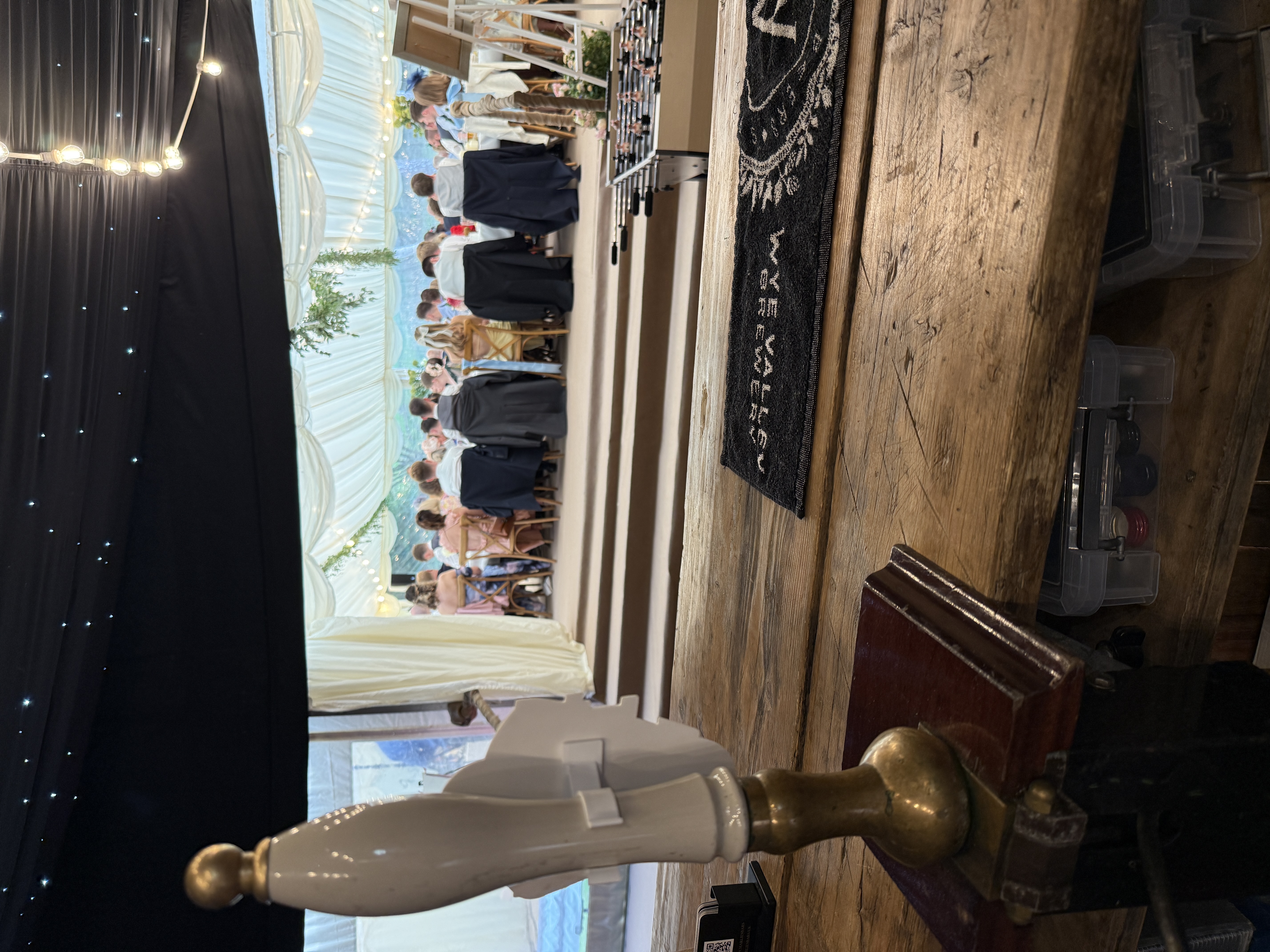 View from behind the bar at a wedding reception in a marquee