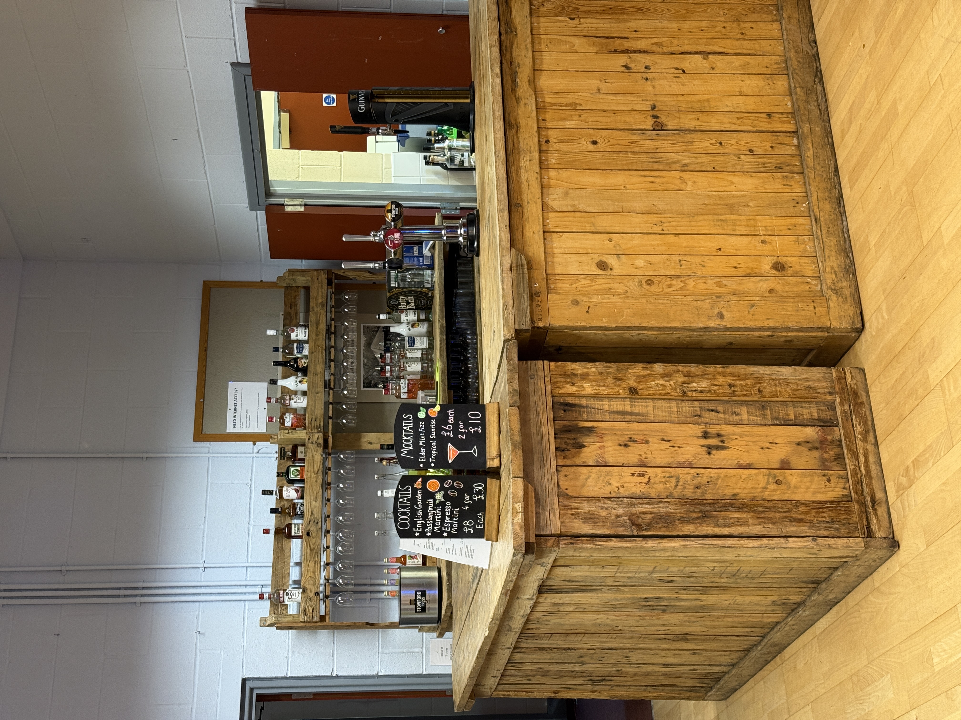 Rustic bar with cocktail and mocktail chalkboard menus