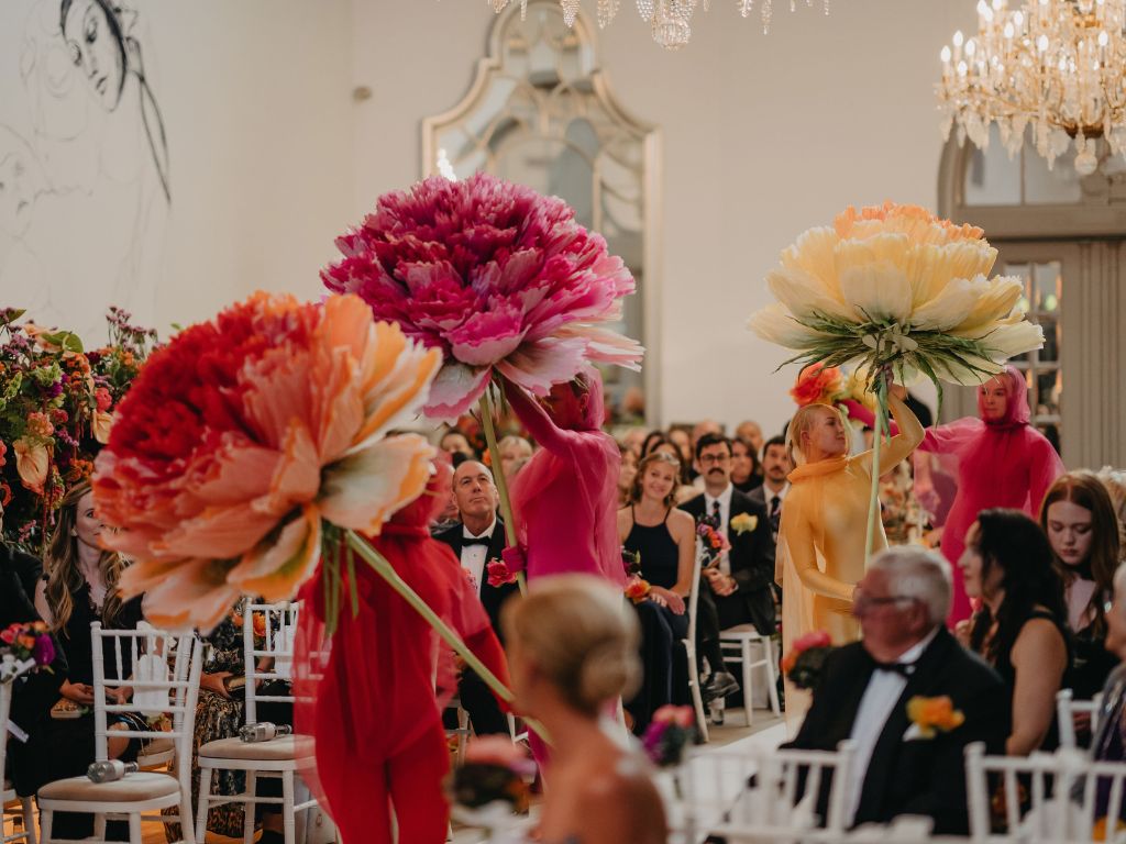 Giant flower performers at a Copenhagen wedding