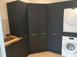 Corner utility room dark fitted cupboards oak worktop sink by Woodgate Joinery Glasgow