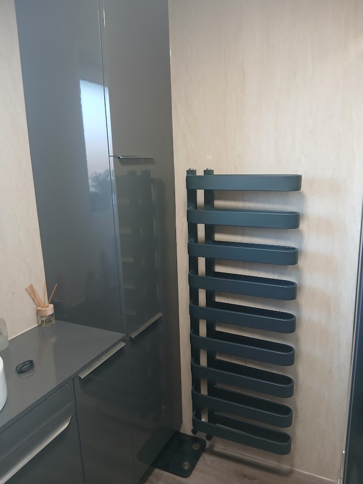 Dark gloss bathroom cabinet with designer anthracite towel radiator by Woodgate Joinery Glasgow