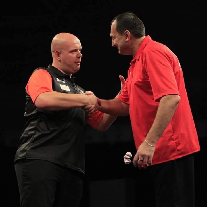 Graham Filby shaking hands with Michael van Gerwen at PDC World Cup of Darts
