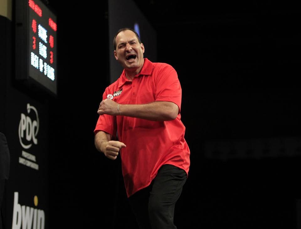 Graham Filby celebrating on the PDC World Cup of Darts stage