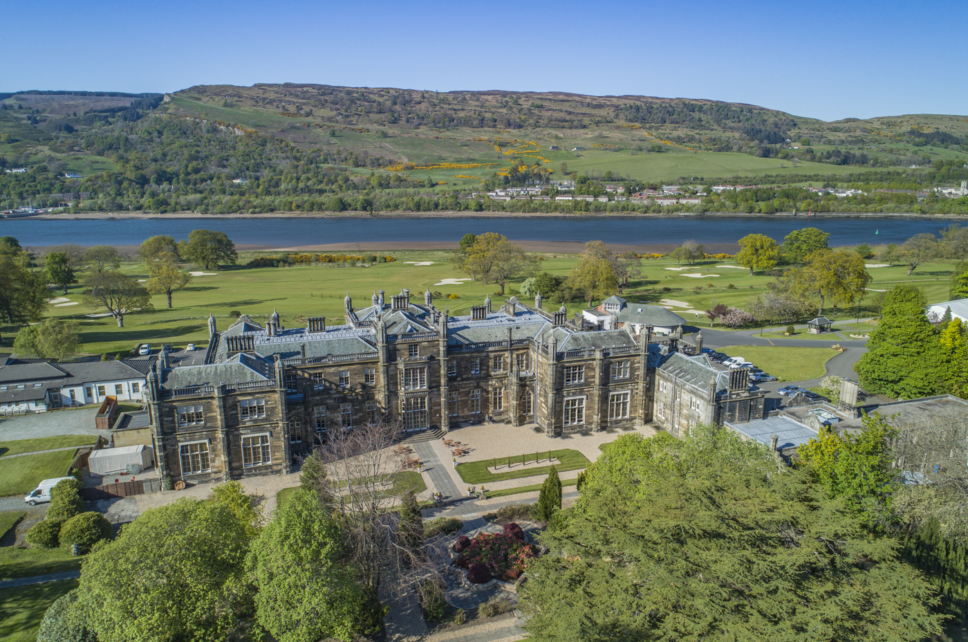 Mar Hall Golf and Spa Resort hotel and gardens — stunning aerial view of the Edwardian mansion, championship golf course, River Clyde and Scottish hills, corporate event venues across the UK by Event Collection