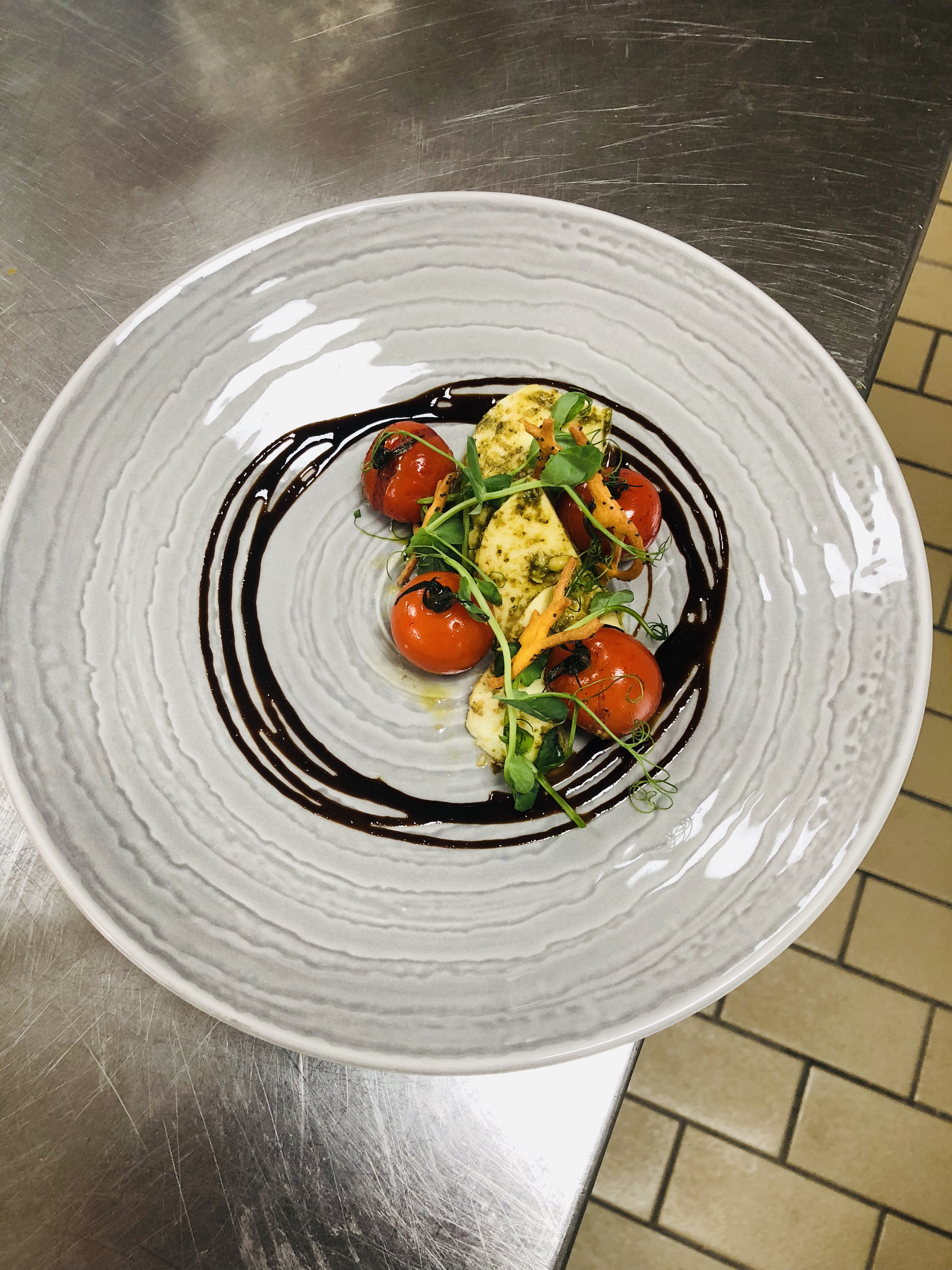 Roasted tomatoes with pesto and balsamic reduction
