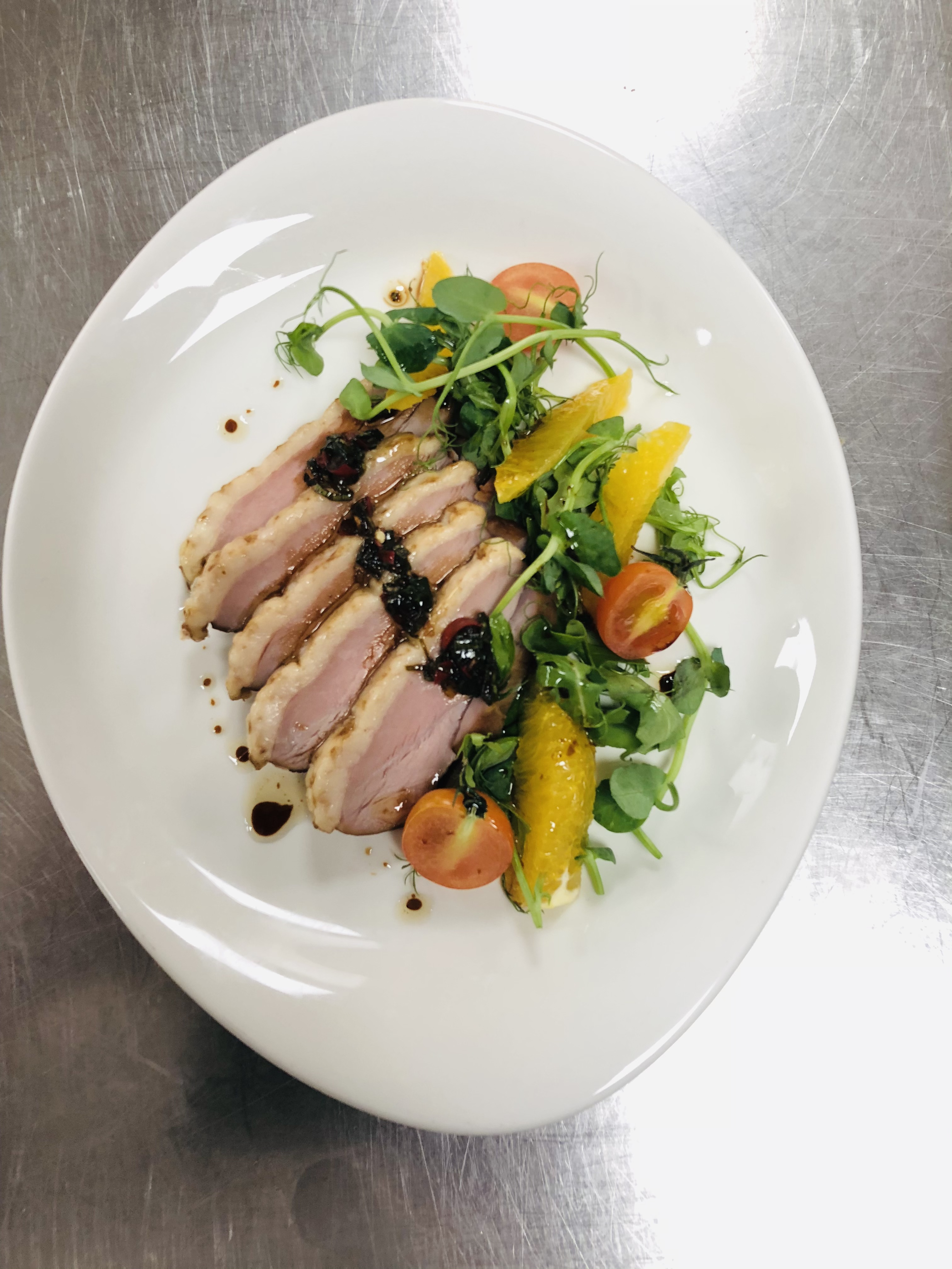 Pan-seared duck breast with orange and watercress salad