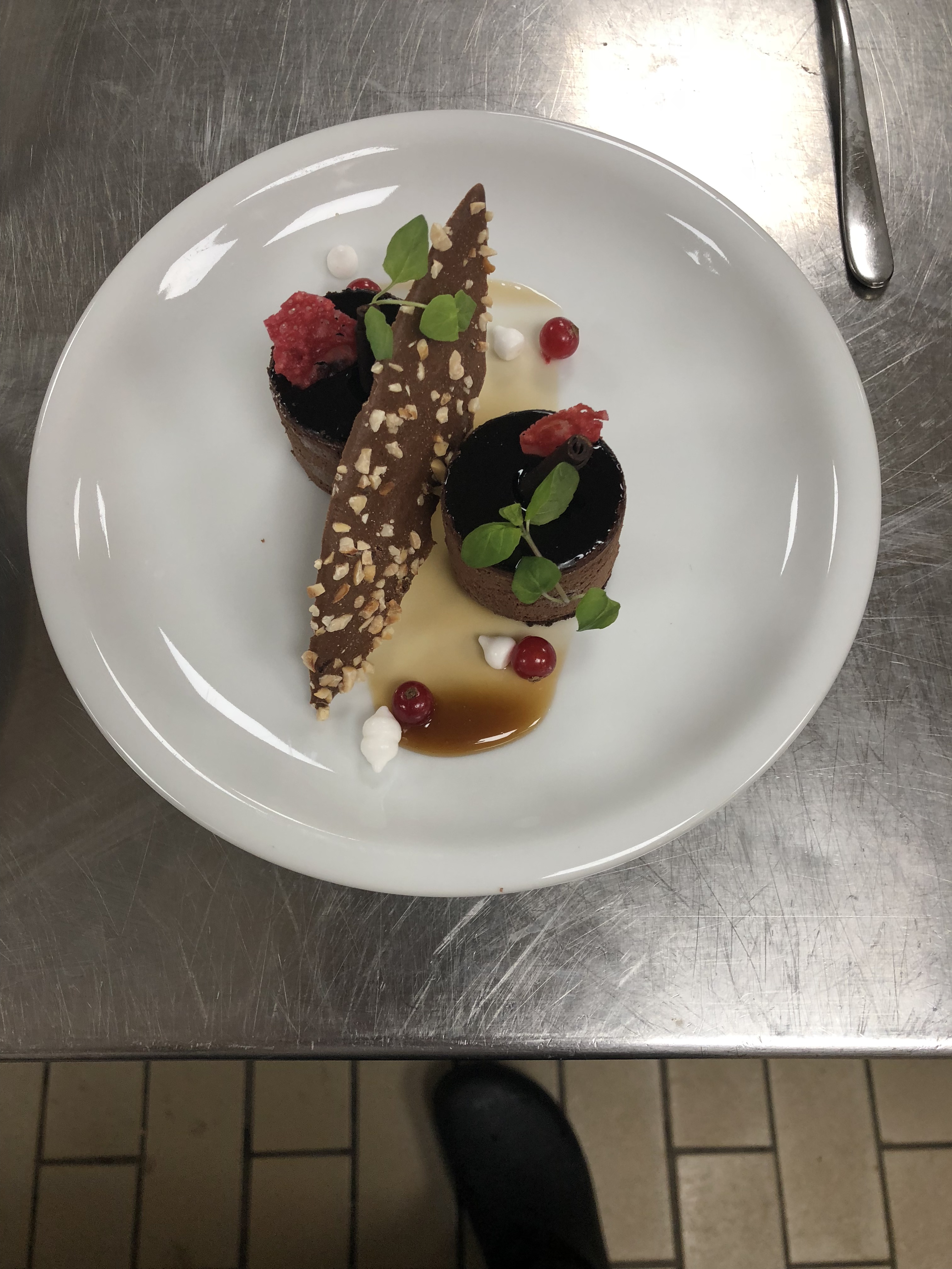 Chocolate dessert with berries and nut tuile
