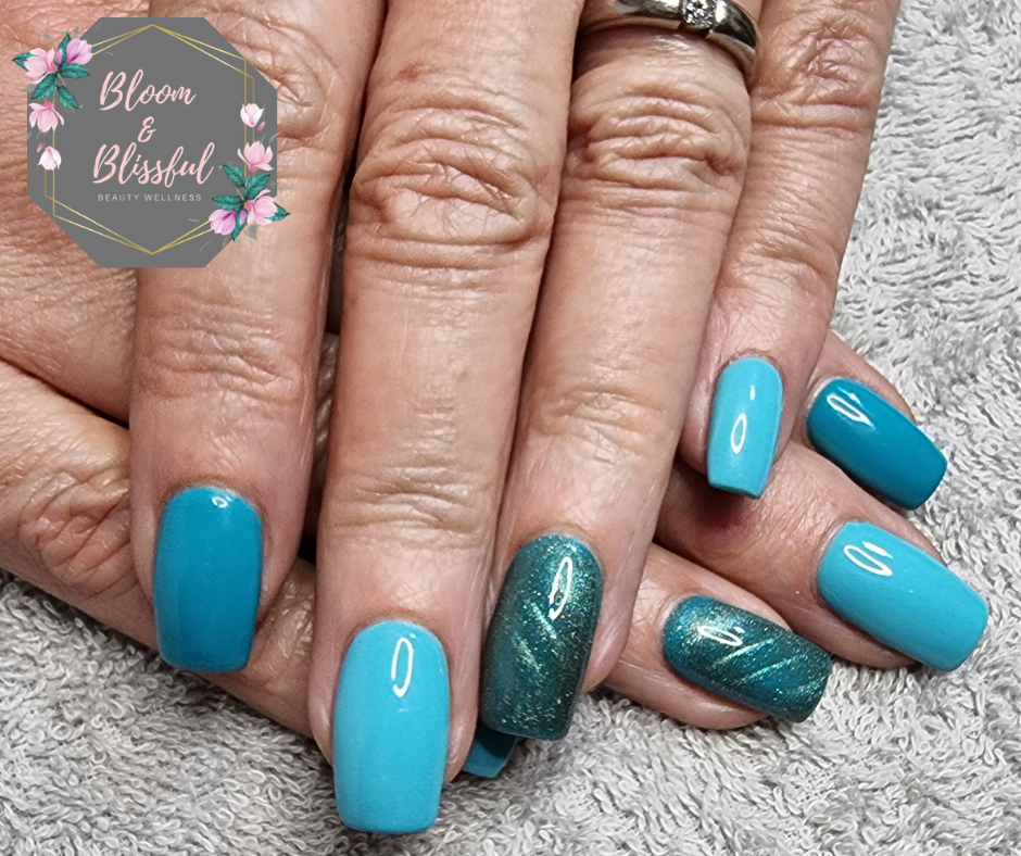 Bright teal blue nails with dark teal shimmer accent by Emmie