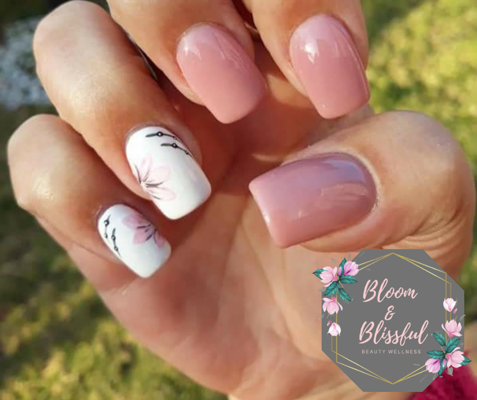 Nude pink nails with delicate floral art by Emmie