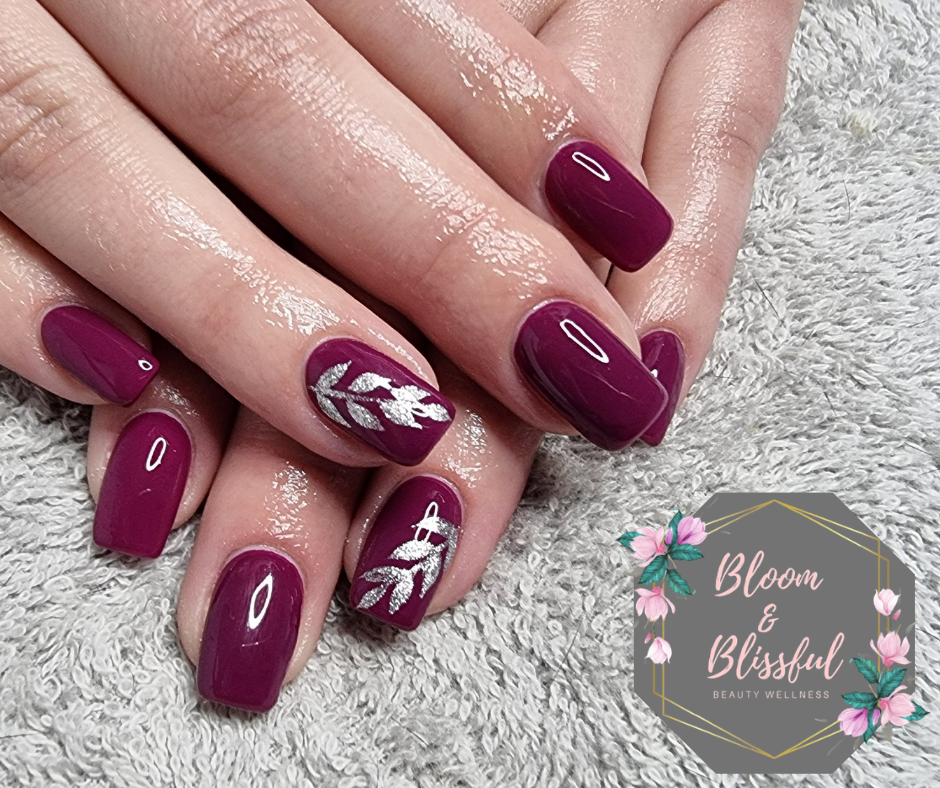Deep plum burgundy nails with silver leaf art accent by Emmie