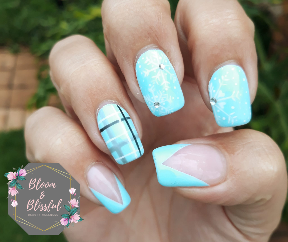 Baby blue nails with snowflake art plaid pattern and geometric accent by Emmie