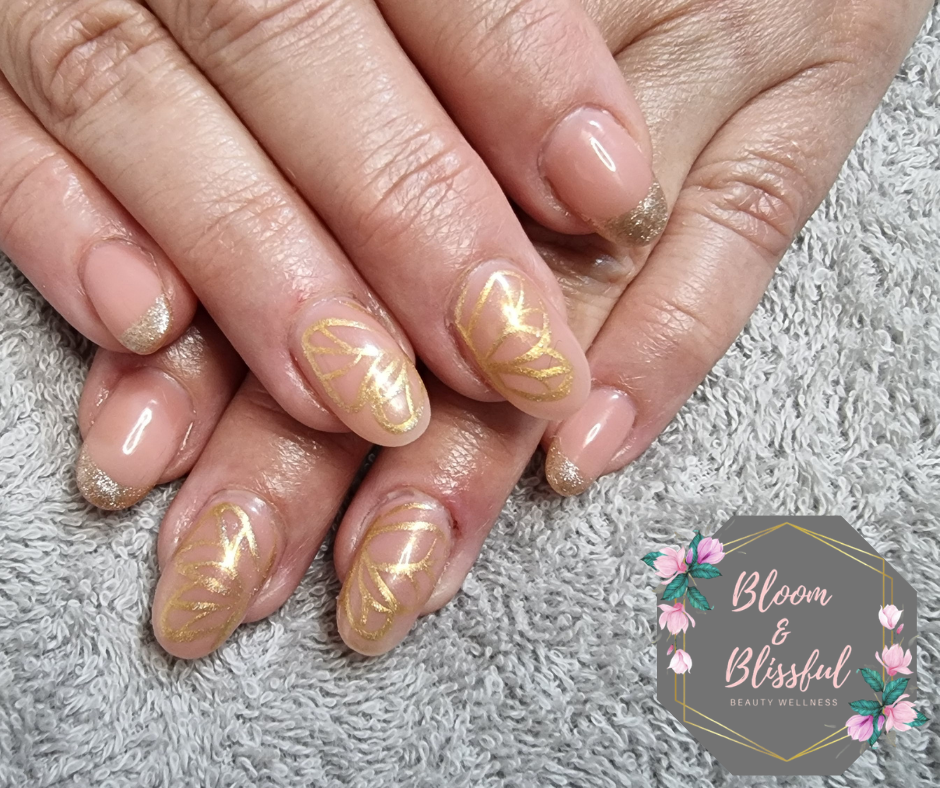Nude nails with delicate gold line art and glitter tips by Emmie