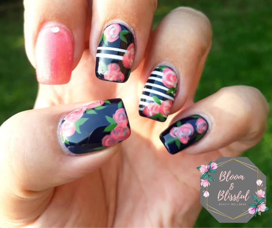 Black nails with hand-painted pink roses and white stripes by Emmie