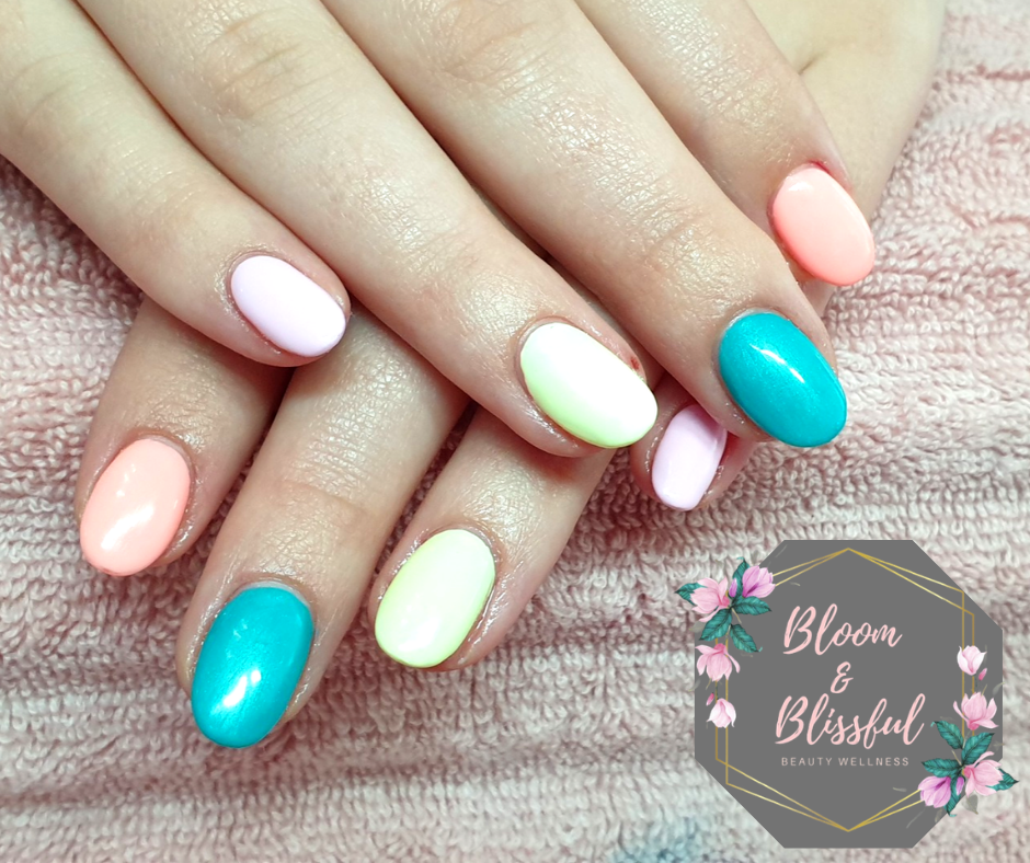 Pastel multicolour nails in teal peach mint and lavender by Emmie