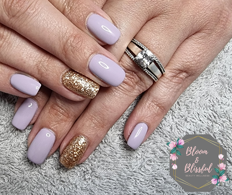 Soft lavender nails with chunky gold glitter accent by Emmie
